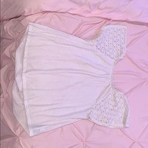 A white summer off/on shoulder shirt.